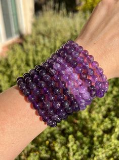 Click the link below to shop more Crystal Jewelry! https://www.etsy.com/shop/CrystallineEarthShop?ref=seller-platform-mcnav§ion_id=36709411 * Listing is for (1) bracelet and is approximately 7 inches. You may choose Light or Dark Amethyst. Amethyst crystals are one of the most beneficial stones to have in your home or office. These crystals work to purify any space of negative vibrations, emanating an energy ideal for you to thrive in. They help to clear the mind of unnecessary thoughts and clut Hand-strung Amethyst Stretch Bracelet, Purple Gemstone Beads Stretch Bracelet, Purple Crystal Bracelet With 8mm Beads As A Gift, Amethyst Bracelet With 8mm Beads, Purple Amethyst Beaded Bracelets As Gift, Purple Bracelets With 8mm Beads For Healing, Purple Round Beads Crystal Bracelet For Healing, Amethyst Beaded Bracelets For Healing, Purple Gemstone Beaded Bracelets For Healing