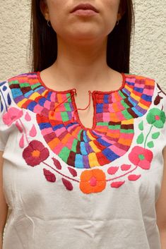 Magia Mexica Mexican Embroidered Blouses Women Blouse multicolored handmade by Mexican artisans. Measurements: ↕ 25 2/5 in ↔ 20 2/7 in WARRANTY We use what is needed to make your item arrives 100% safe and intact to your address. SHIPPING & DELIVERY TIMEFRAME We ship your order within 1-2 days after purchase USA: *Free Shipping USA 15-20 business days *Standard: 1 week * Express: 3 days Rest of the World: *Standard 4-6 weeks * Express: 5 days Every order is shipped within 1 business day Incl Traditional Multicolor Embroidered Top For Fiesta, Multicolor Embroidered Festival Top, Multicolor Bohemian Embroidered Top For Fiesta, Multicolor Cotton Tops For Cinco De Mayo, Cinco De Mayo Multicolor Cotton Tops, Multicolor Tops For Cinco De Mayo Festival, Multicolor Top For Cinco De Mayo Festival, Multicolor Bohemian Embroidered Top With Border, Bohemian Multicolor Blouse With Embroidered Border