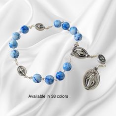 Little Crown of The Blessed Virgin Mary - Chaplet of The Immaculate Conception Miraculous Medal Catholic Prayer Beads Mary Devotions Chaplet of the Immaculate Conception. Little Crown of The Blessed Virgin Mary chaplet with Miraculous medals made with 8mm glass beads of your choice. Thank you for considering! For more similar items and different colors visit our store: https://www.etsy.com/shop/Thelightjewelry?ref=seller-platform-mcnav Adjustable Rosary Bracelet With 8mm Beads For Wedding, Adjustable 8mm Bead Rosary Bracelet For Wedding, Spiritual Beaded Rosary Bracelet For Wedding, Personalized Rosary, The Immaculate Conception, The Blessed Virgin Mary, Immaculate Conception, Blessed Virgin, Blessed Virgin Mary