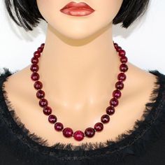 ♥ Ready to ship ♥ 100% handmade ♥ Packed in a gift box ♥ Custom length ♥ Gemstone: Genuine faceted ruby red agate (other colors available, just contact me) ♥ Bead size 12mm Handmade Ruby Red Agate Bold Statement Necklace! This one-of-a-kind piece embodies the perfect fusion of elegance and boldness.  The magnificent, deep red hue of the Ruby Red Agate beads effortlessly catches the eye, exuding a captivating charm.  Each bead is meticulously handpicked and threaded with care, resulting in a trul Red Crystal Necklace With Gemstone Beads, Red Crystal Necklaces With Gemstone Beads, Red Crystal Necklace With Natural Stones, Red Gemstone Crystal Necklace With Round Shape, Red Ruby Faceted Beaded Necklaces, Red Ruby Beaded Necklaces With Faceted Details, Red Ruby Round Beaded Necklace, Red Ruby Beaded Necklace, Red Ruby Cut Beaded Necklaces