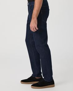 Wilcox is our new relaxed tapered fit, featuring a wider fit throughout the thigh that tapers in at the bottom to a 14” leg opening. This pair is crafted from our new PAIGE Heritage denim in a dark indigo wash with mixed metal hardware. Our Heritage denim offers the same vintage-inspired character while maintaining the soft hand-feel and comfort you’ve come to love and expect from PAIGE. | PAIGE Heritage Wilcox Tapered Jean - Barela Blue | Size 38 Mixed Metal Hardware, Men Store, Dark Indigo, Denim Shoes, Tapered Jeans, Soft Hands, Soft Hand, Metal Hardware, Vintage Inspired