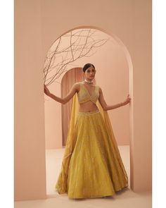 Shop for the perfect bridal party Lehenga at Parul Gandhi. This Yellow lehenga with intricate hand embroidery work and detailing is crafted with the finest materials for a royal look on your special day. Made to Order Indian Wedding Bride Dress and Custom Made Indian bridal Lehenga (Bay Area) Online Shipping Worldwide to UK, Germany, USA, Australia, Canada. Elegant Designer Yellow Sharara, Elegant Designer Wear Yellow Sharara, Elegant Yellow Sharara With Pallu, Elegant Yellow Traditional Wear For Navratri, Elegant Yellow Traditional Wear With Cutdana, Elegant Yellow Sharara For Diwali, Elegant Yellow Sharara For Festivals, Elegant Yellow Traditional Wear For Festive Occasions, Yellow Fitted Elegant Sharara