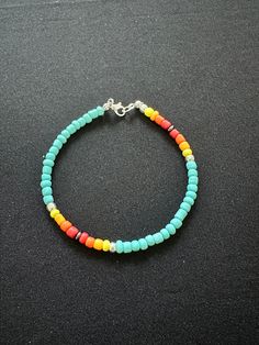 Stunning southwestern colored bracelet! these colors will put a smile on your face. They're handcrafted with small glass beads and quality thick stretch cord.   Approx. 7" round which is standard for most adult wrists.   Features: ✔ Glass beads ✔ Quality stretch cord ✔ Silver colored clasp ✔ This is not a stretch bracelet Casual Turquoise Bracelets With Large Beads, Casual Turquoise Stretch Bracelet With Colorful Beads, Colorful Adjustable Casual Beads, Multicolor Bohemian Stretch Bracelet, Bohemian Multicolor Stretch Bracelet, Blue Casual Stretch Bracelet For Festivals, Casual Blue Stretch Bracelet For Festival, Turquoise Stretch Bracelet With Colorful Beads, Casual Turquoise Beaded Bracelets With Spacer Beads