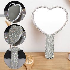 the heart shaped mirror is next to a brush and toothbrush on a wooden table