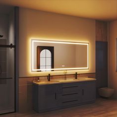 a bathroom with a large mirror and two sinks