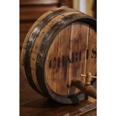 a wooden barrel sitting on top of a table