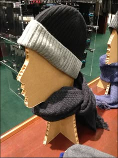 the mannequin is wearing a hat and scarf