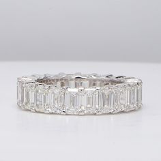 Ninacci 14K White Gold Eternity Band with Shared Prong Set Emerald-Cut Diamonds - 7.15 Carat Total Diamond Weight - Size 7 Luxury Modern Eternity Band With Prong Setting, Cubic Zirconia Eternity Band With Asscher Cut Prong Setting, Fine Jewelry Emerald Cut Baguette Diamond Eternity Band, Emerald Cut Cubic Zirconia Eternity Band With Baguette Diamonds, Elegant Radiant Cut Eternity Band With Prong Setting, Timeless Emerald-cut Cubic Zirconia Eternity Band, Timeless Emerald Cut Diamond Eternity Band, Diamond Eternity Band With Baguette Cut, Elegant Radiant Cut Diamond Eternity Band