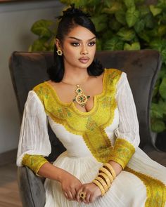 This elegant golden Habesha dress displays traditionally unique craftmanship with modern finishing and pattern style. The gorgeous essence of the dress offers beautiful look for any special occasions planned. Material Cotton Menen Thread Estimated delivery : 1 week to 2 weeks Contact WhatsApp +1(304)-306-2784Email: contact@ethiopian.store Holiday Wedding Dress, Habesha Kemis Ethiopian Dress, Leg Jewelry, Habesha Dress, Ethiopian Traditional Dress, Ethiopian Dress, Habesha Kemis, Dress Display, Traditional Dress