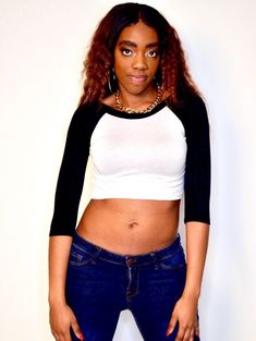 "This 3/4 sleeve white and black crop top fits soft and smooth against your body.  It is made from the popular and sporty raglan cut, and has a white body with black sleeves and collar. Best paired with: Jeans, cutoff shorts, yoga pants, or your favorite mini-skirt. The model is 5'6\" and wearing a size small. The fabric is stretchy and adjusts to the shape of your body.  Although we make every effort to portray the accurate colors, colors and fit may vary slightly from the picture due to lighting and body type, as with all apparel. Size Chart (inches):                              S            M           L Bust                      27-30 31-34    34-37 Natural Waist        26            28    30 Length                        12.5             13     15  Materials:  95% rayon, 5% spandex. Trendy White Stretch Cropped Shirt, Black Fitted Half Sleeve Tops, Black Fitted Half-sleeve T-shirt, Black Fitted Half Sleeve T-shirt, White Fitted Top With 3/4 Sleeves, Fitted Black Top With 3/4 Sleeves, White Stretch Top With 3/4 Sleeve, Fitted Casual T-shirt With 3/4 Sleeves, Casual Fitted T-shirt With 3/4 Sleeves