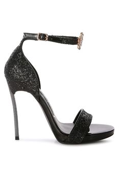 With the glam quotient so high, this pair of stiletto party sandals come with floral jewel brooch detailing for you to stand out. The sandals are all glittery, have a pin buckle fastening for a secure fit, and would look stunning at parties, weddings, and any event that needs you to glam up!Type: Stiletto HeelsUpper Material: Glitter Faux LeatherLight Cushion InsoleOuter Sole: TPRStiletto HeelOpen ToePin Buckle FasteningFloral Jewel DetailHigh-Heeled Party SandalSH3849 Style: Party Sandals Embel Glamorous Evening Open Toe Sandals, Glamorous Party Sandals With Heel Strap, Embellished Open Heel Prom Heels, Embellished Open Heel Heels For Prom, Embellished High Heel Evening Sandals, Open Toe Heels With Glitter Accents For Party, Party Sandals With Buckle Closure And Round Toe, Embellished High Heel Sandals For Evening, Glamorous High Heel Sandals With Glitter Accents