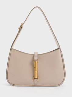 This product is made with at least 20% sustainable materials by weight. CHARLES & KEITH uses recycled, degradable, organic, and water-based materials in our eco-conscious collection.Taupe is the neutral colour to be seen in this season. An elegant blend of brown and grey, this understated hue will bring a refreshing touch to your new seasonal everyday wardrobe. Consider incorporating it in the form of the Cesia, featuring a clean-lined silhouette that will effortlessly elevate any look with eleg Everyday Beige Shoulder Bag With Bamboo Handle, Eco-friendly Shoulder Bag With Bamboo Handle, Beige Recyclable Tote Shoulder Bag, Beige Recyclable Shoulder Bag For Everyday Use, Everyday Cream Shoulder Bag With Bamboo Handle, Cream Shoulder Bag With Bamboo Handle For Everyday Use, Modern Shoulder Bag With Bamboo Handle For Daily Use, Eco-friendly Neutral Rectangular Shoulder Bag, Everyday Bucket Shoulder Bag With Bamboo Handle