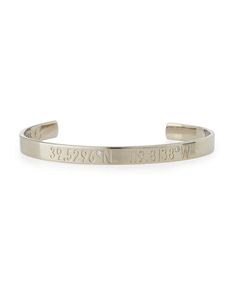 Coordinates Collection engravable bangle. Brass plated in silver, 14-karat gold, or 14-karat rose gold. Coordinates may be customized. Submit address to vendor who will turn into coordinates for the customized bangle. Punctuated by round white diamonds. 0.003 total diamond carat weight. Approx. 2.3" diameter. Approx. 6mm wide. Opening for slip-on style. Made in USA. Timeless Sterling Silver Bangle As Gift, Timeless Engraved Bangle Jewelry, Luxury Engraved Cuff Bangle Bracelet, Timeless Sterling Silver Bangle For Gift, Luxury Engraved Bangle Cuff Bracelet, Luxury Engraved White Gold Cuff Bracelet, Timeless Engraved Sterling Silver Bracelet, Luxury Engraved Cuff Bracelet For Anniversary, Silver 14k Gold Cuff Bangle Bracelet