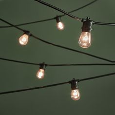 some light bulbs are hanging from a wire