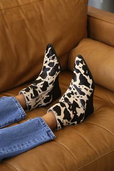 There are so many ways to incorporate animal print into your outfit. These Western-inspired spotted pony animal print with a black-meets-brown and white color scheme brings maximum chicness. The wedge heel adds the right amount of height! A fall outfit wouldn't be complete without these perfect ankle boot. #lovelulus Chic Ankle-high Winter Wedge Boots, Chic Ankle-high Wedge Boots For Winter, Fall Ankle-high Wedge Boots, Chic High Heel Wedge Boots For Fall, Chic High-top Fall Boots, Fall Ankle-high Wedge Boots With Reinforced Heel, Chic High-top Boots For Fall, Chic Pointed Toe Wedge Boots For Fall, Spring Stacked Heel Ankle Wedge Boots