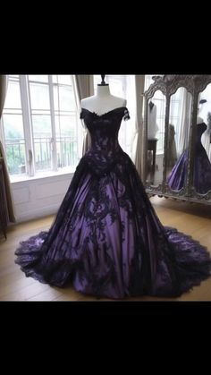 a purple ball gown on display in front of a mirror