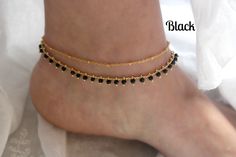 Brilliant crystal beads and tiny golden balls drape gracefully on golden chains to create these flirty and fun gold anklets. Each gold plated anklet is adjustable between 9 - 11 inches in length. Need a different length? Please contact me and I will be very happy to help you! These anklets are available in black, peach, mint, red, blue, and fiesta colors. Please select your preferred crystal color when checking out. ◊ Shipping & Store Policies ◊ Please refer to my Shipping & Policies her Gold Anklets With Round Beads For Festival, Elegant Adjustable Anklet With Tiny Beads, Gold Anklets With Tiny Beads As Gift, Elegant Handmade Anklets With Round Beads, Elegant Handmade Anklets With Beads, Gold Beaded Anklets For Gift, Adjustable Beaded Gold Anklets, Gold Beaded Anklets For Party, Dainty Gold Anklets For Festivals