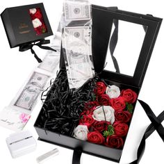 a black box with roses and money in it