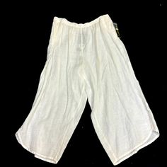 Plus Size Linen Cropped Pants By Ic By Connie K. Elastic Waistband, Side Pockets. Nor Stark White, More Of An Ivory Color. 3 Button Detail At Hemline Of Pant Legs.#72493 Non-stretch Capri Bottoms With Pockets, Summer Capri Bottoms With Pockets, Solid Capris With Pockets For Vacation, Solid Color Capris With Pockets For Vacation, Vacation Capris With Pockets, Wide Leg Capris With Pockets For Beach, Casual Wide Leg Capris For Vacation, Vacation Wide Leg Capris With Pockets, Casual Summer Capri Pants