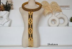 African jewelry tribal zulu neck piece beaded designer jewelry African pendant handmade gold necklace African fashion tribal gift idea PRODUCT SPECIFICATIONS: Necklace length - 60.0 cm. pendant height - 50.0 cm. Closure - press stud Colors - black and gold. Materials - beads. ADDITIONAL INFORMATION New and unworn: Yes Handmade in Kenya: Yes Other jewelry in my shop: https://www.etsy.com/shop/shakava Traditional Handwoven Gold Jewelry, Gold Fair Trade Beaded Jewelry, Unique Gold Beaded Choker, Unique Handmade Gold Bib Necklace, Bohemian Gold Beads For Ceremonial Use, Bohemian Gold Beaded Necklaces For Ceremonial Occasions, Gold Bohemian Beaded Necklace For Ceremonial Occasions, Gold Fair Trade Necklace For Festival, Traditional Gold Beaded Choker Necklace