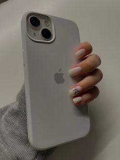 a woman's hand holding an iphone case