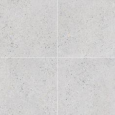 four squares of cement with small speckles on the top, bottom and bottom