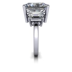 Solid Silver Cocktail ring shown with a 12x10mm, 8.00 ct. radiant cut colorless simulated diamond and (2) 7x5mm emerald cut colorless simulated diamonds, 2.00 ct. Band width 2.2mm.10.00 carat total weight. *Sterling Silver is Rhodium dipped to reduce tarnishing. Rhodium is a very strong metal that creates a protective layer over the sterling silver, making it more resistant to tarnishing. *Custom made at the time of order. Mens Gemstone Rings, Rings Mens Wedding Bands, Simulated Diamond Rings, Moissanite Necklace, White Gold Set, Forever One Moissanite, Colorless Diamond, Lab Grown Diamonds Engagement, Black Diamond Ring