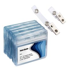 two pieces of plastic with metal clips attached to each other on a white background next to the package