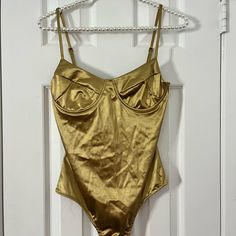 Spring Party Bodysuit With Built-in Bra, Fitted Bodysuit With Built-in Bra For Party, Fitted Party Bodysuit With Built-in Bra, Gold Fitted Bodysuit For Club, Elegant Gold Bodysuit For Summer, Party Bodysuit With Built-in Bra, Gold Bodysuit For Night Out, Party One-piece Bodysuit With Built-in Bra, Gold Party Bodysuit With Lined Body