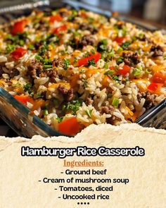 a close up of a casserole dish with rice and vegetables in it on a table