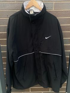 Vintage 1990s Nike Embroidered Swoosh Windbreaker Track Jacket - Size XL (Length 32", Chest 26") - Great vintage condition (no holes/no stains) - On the very rare 90s Made in USA Nike tag!! - Message for more information Please take note of the measurements listed as these are vintage clothes and may fit different than the tag size. Follow our page for more vintage clothing drops! Connect with us on Instagram: @recurarchives Nike 90s Vintage Women, Nike 90s Vintage Hoodie, Jacket Nike Vintage, Sporty Windbreaker For College Sports Season, Sporty Black Windbreaker For Sports Season, Sporty Black Windbreaker For College, Black Crew Neck Track Jacket For Streetwear, Black Sporty Windbreaker For College, Black Sporty College Windbreaker