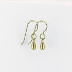 "Tiny gold color anodized titanium teardrop earrings are a pretty staple piece for your sensitive ears. They dangle from titanium French earwires hooks. The titanium is colored through anodizing, this makes the outer layer thicker with titanium and doesn't add other metals, so it is still pure titanium, but colored a beautiful yellow gold. These earrings are completely made out of pure titanium findings and therefor safe for when you have severe nickel allergies. Simple jet feminine for everyday Gold Hypoallergenic Brass Teardrop Earrings, Gold Hypoallergenic Teardrop Earrings For Everyday, Hypoallergenic Gold Teardrop Brass Earrings, Hypoallergenic Gold Teardrop Earrings In Brass, Hypoallergenic Metal Teardrop Pendant Earrings, Minimalist Adjustable Hypoallergenic Teardrop Earrings, Gold Hypoallergenic Teardrop Earrings Gift, Adjustable Gold Teardrop Earrings With Ear Wire, Hypoallergenic Gold Teardrop Earrings Gift