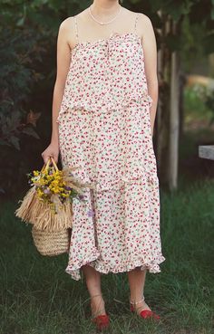 A lightweight floral dress with spaghetti straps, ruffled hem, and a flowing silhouette. Perfect for a cottagecore and bohemian summer style. No tags The model wears size 38 The size is adjustable, suitable from S - L the fabric feels like polyester Clothes care Machine washable Please note: We sell vintage items, not new ones. All our items are in excellent condition, washed, ironed and ready to wear. We also repair some items, sew on buttons and keep them in perfect condition. Please expect normal wear/age. Spaghetti Strap Midi Dress With Ruffles For Garden Party, Flowy Summer Maxi Dress For Picnic, Midi Length Sundress With Ruffle Hem For Daywear, Flowy Sundress For Picnic, Summer Daywear Midi Dress With Ruffle Hem, Casual Midi Dress With Ruffled Straps, Bohemian Maxi Dress With Ruffled Straps, Flowy Floral Midi Dress With Ruffled Straps, Flowy Floral Print Midi Dress With Ruffled Straps