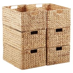 two wicker storage baskets with handles on each side, one large and one small