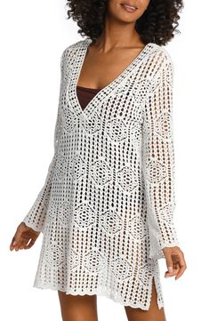 Crochet-inspired stitches lend delicate charm to this long-sleeve cover-up dress made of breezy cotton with abbreviated slits at the sides. 32" length (size Medium) V-neck Long sleeves Sheer; base layer shown not included 100% cotton Hand wash, dry flat Imported Long Sleeve Open Knit Cover-up For Beachwear, Long Sleeve Open Knit Cover-up, Chic Fitted Long Sleeve Cover-up, Spring Fitted Long Sleeve Cover-up, Fitted Long Sleeve Cover-up For Spring, White Long Sleeve Beach Dress, Fitted Long Sleeve Summer Cover-up, Fitted Long Sleeve Spring Cover-up, White Long Sleeve Open Knit Cover-up