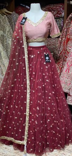 Crimson red sequence work lehenga with contrasting blush pink blouse and net dupatta. Fabric: Net This outfit can be customized in multiple colors and specific to client measurements. 90 days of production time is required and are for bulk orders only! Orders are processed in store only! Final fittings/alterations not included. Minimum Order Quantity- 4 pieces Designer Party Wear Red Lehenga, Red Designer Party Wear Lehenga, Festive Net Gown For Party, Festive Net Gown For Party Occasions, Festive Party Gown In Net Material, Party Wear Net Anarkali Set For Wedding, Net Anarkali Set For Wedding Party, Wedding Party Wear Anarkali Set In Net, Festive Net Gown With Traditional Drape