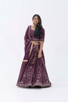 Plum Purple mirror work lehenga choli Matched with Purple mirror work blouse with quarter sleeves. Designed with round neck and has back hooks. Set together with a matching soft net purple duppata with mirror work and have gold border The length of the blouse is 14 inches. Blouse can fit a size 32 to 42 The maximum length of the lehenga will be 41 inches. Slight variation in color is possible due to digital photography. This is a 3 piece set. Care: dry clean only We provide side fitting/sleeves Purple Dola Silk Saree With Mirror Work, Purple Salwar Kameez With Mirror Work For Navratri, Navratri Purple Salwar Kameez With Mirror Work, Purple Chanderi Traditional Wear With Mirror Work, Designer Purple Dupatta With Gota Work, Purple Dupatta With Dori Work For Navratri, Purple Saree With Gota Work For Navratri, Purple Gota Work Saree For Navratri, Purple Designer Dupatta With Mirror Work