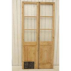 two wooden doors with chalkboard on them