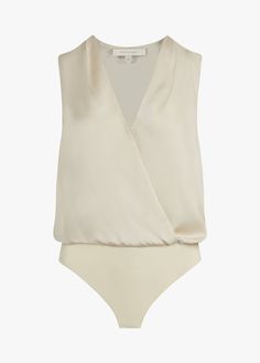 Text me when you get home. Our best-selling, satin bodysuit with a pleated neckline and button cuffs, now in a sleeveless version. The soft drape of the top is a no-fuss tuck thanks to the comfortable snap bodysuit so it's effortlessly easy to wear on its own and a favorite look when styled under a blazer.100% POLYESTERAdrianna is 5'9" wearing size Small Satin Bodysuit, Pleated Neckline, Heel Accessories, Blouse Sleeveless, Favorite Daughter, Color Crush, Classic Chic, Polyester Satin, Denim Flares