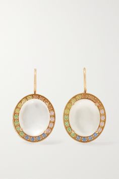 Andrea Fohrman's earrings are centered with beautifully iridescent moonstones, which are said to enhance intuition and bring good fortune to the wearer. They're handcrafted from 18-karat gold and framed by pastel sapphires. Luxury White Oval Earrings, White Multi-stone Earrings Fine Jewelry, Elegant White Multi-stone Earrings, Luxury White Earrings With Gemstone Accents, Luxury Multi-stone Moonstone Jewelry, White Fine Jewelry Earrings With Gemstone Accents, Yellow Gold Multi-stone Moonstone Jewelry, White Gemstone Accented Round Earrings, Elegant Moonstone Earrings With Gemstone Accents