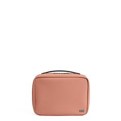 an empty pink case sitting on top of a white surface