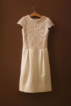 This listing is for the Thommy Dress. The sheath dress is handmade with #5320 ivory French alencon lace with cream lining and ivory linen. the detachable tulle skirt is made with an ivory sash and white, light ivory, and ivory tulle. The Thommy Dress is a shift dress for girls who need to look the part for a wedding, Bat Mitzvah, or First Communion, but who also prefer comfortable, sporty attire. They love its soft knit bodice lining and linen, and the hooks that keep the sash in place without s Elegant Dress With Lace Top And Fitted Bodice, Elegant Dress With Delicate Lace And Fitted Bodice, Fitted Scallop Lace Bridesmaid Dress, Fitted Delicate Lace Bridesmaid Dress, Beige Lace Bridesmaid Dress, Elegant Scalloped Lace Bridesmaid Dresses, Bridesmaid Beige Lace Dress, Fitted Delicate Lace Dress For Wedding Guest, Feminine Sheath Lace Dress For Wedding