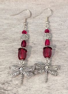 October "Tourmaline" just added!! Whimsical ** "birthstone" ** dragonfly charm earrings Each version is lovingly crafted with silver plated ear wires, beads, bead caps and Art Nouveau style dragonfly charms 🤗 Current variations are as follows: January: "Garnet" features pressed glass beads and faceted beads in rich dark maroon red February: "Amethyst" features sugilite stone beads, purple glass beads and glass pearls  March: "Aquamarine" features light blue sea sediment imperial jasper & glass Adjustable Crystal Drop Earrings For Gift, Adjustable Drop Crystal Earrings As Gift, Whimsical Silver Earrings For Gift, Hypoallergenic Dangle Crystal Earrings Gift, Adjustable Silver Birthstone Earrings, Silver Dragonfly Earrings For Gift, Silver Dragonfly Earrings Perfect For Gifts, Dragonfly-shaped Pierced Earrings As Gift, Nickel-free Adjustable Dragonfly Jewelry