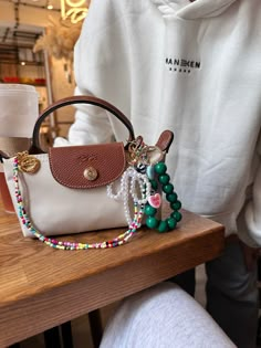 Repurpose Louis Vuitton Purses, Summer Bags Aesthetic, Girly Purse Aesthetic, Cute Bag Charms Aesthetic, Bag With Charms Aesthetic, Decorated Purse Aesthetic, Purse With Charms, Mini Purse Aesthetic, Bag Accessories Aesthetic