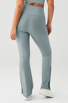 Everything you love about forward flares, now in a sleek new silhouette! The High-Waist 7/8 Game Changer Legging in performance-perfect Airlift is ready for studio days and nights out, with Alo’s signature high rise and secure wide waistband. A flared leg with side snap closure adds extra ventilation and is great for showing sneakers! Effortlessly tie this look together by pairing it with a cropped coverup. Smoothing, second skin feel & cool side snaps Forward bootcut fit & wide waistband Design Alo Yoga 4-way Stretch Elastane Bottoms, Alo Yoga Compression Bottoms For Pilates, Alo Yoga Athleisure Bottoms For Pilates, Alo Yoga 4-way Stretch Athleisure Bottoms, High Stretch Alo Yoga Pants For Yoga, Alo Yoga Elastane 4-way Stretch Bottoms, Alo Yoga Elastane Bottoms With 4-way Stretch, Alo Yoga 4-way Stretch Bottoms, Alo Yoga High Stretch Athleisure Pants