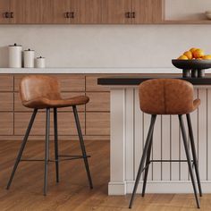 two stools sitting in front of a counter with oranges on top of it