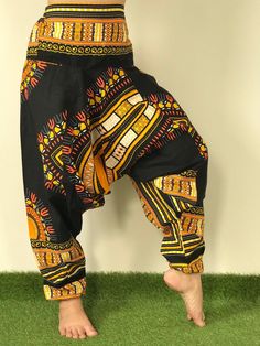 "Dashiki Design, Harem Pants ,Handmade pants, Thick Smock Waist Low Crotch,Bohemian Harem cotton pants, African Dashiki Harem, Aladdin harem pants are very roomy, loose fitting and extremely comfortable. Elasticated both at the waist and ankle, with the crotch just below the knee. Bohemian Harem Unisex pants, Aladdin pants, Baggy Pants, Drop Crotch Pants. Dashiki pants, Yoga pants, Boho Hippi pants. *Fabric Type: Best Quality Fabric Cotton 100%. *Elastic Waist and around ankle. *Quality sewing. Traditional Harem Pants For Navratri, Traditional Multicolor Trousers, Traditional Cotton Harem Pants, Traditional Multicolor Harem Pants With Elastic Waistband, Traditional Cotton Block Print Pants, Traditional Cotton Harem Pants For Navratri, Traditional Multicolor Bottoms With Elastic Waistband, Black Cotton Hippie Pants, Traditional Block Print Cotton Pants