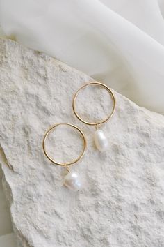 Looking for the perfect high-quality everyday hoops? Our Endless Hoop Earrings are the perfect choice! Made from gold filled metal, these hoops are long lasting and effortlessly stylish. These earrings can be worn alone or paired with a pearl charm for a more sophisticated look. Product Details: 20mm gold-filled hoops Optional add on keshi pearl charms 35mm length with pearls Clean Jewelry, Gold Filled Hoops, Keshi Pearls, Jewelry Photography, Pearl Charms, Cleaning Jewelry, Gold Filled, Hoop Earrings, Long Lasting