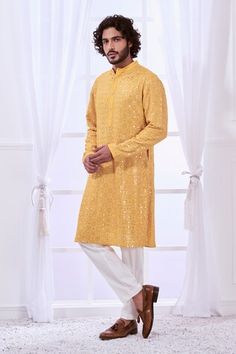 Honey yellow straight kurta with tonal chikankari embroidery highlighted with mirror like work. Comes with contrasting solid pyjama. - Aza Fashions Yellow Chanderi Sherwani With Resham Embroidery, Yellow Sherwani With Resham Embroidery In Chanderi, Yellow Chanderi Sherwani With Chikankari Embroidery, Yellow Chanderi Sherwani For Eid, Designer Yellow Sherwani With Dabka Work, Yellow Sherwani With Dabka Work For Designer Wear, Festive Yellow Chanderi Sherwani, Embroidered Yellow Chanderi Sherwani, Yellow Straight Kurta With Mirror Work