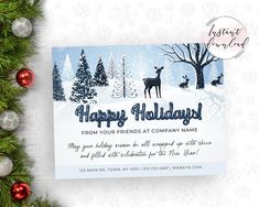 a christmas card with an image of a deer in the snow